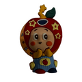 Cavalla Goods apple-inspired character phone grip with star motifs and a cheerful face for a secure smartphone hold.